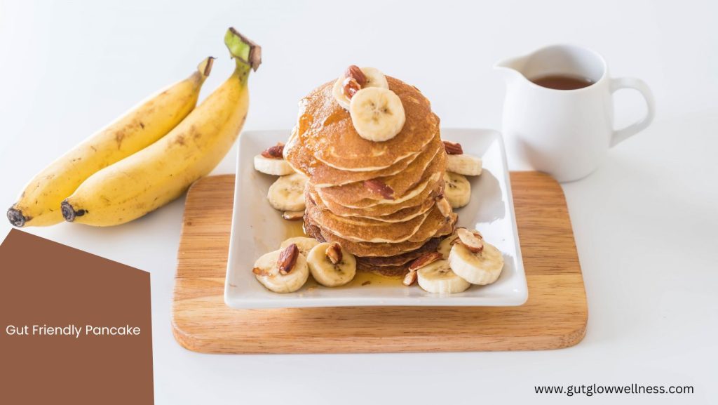 Stack of whole-wheat pancakes with sliced banana and chia seeds on a plate